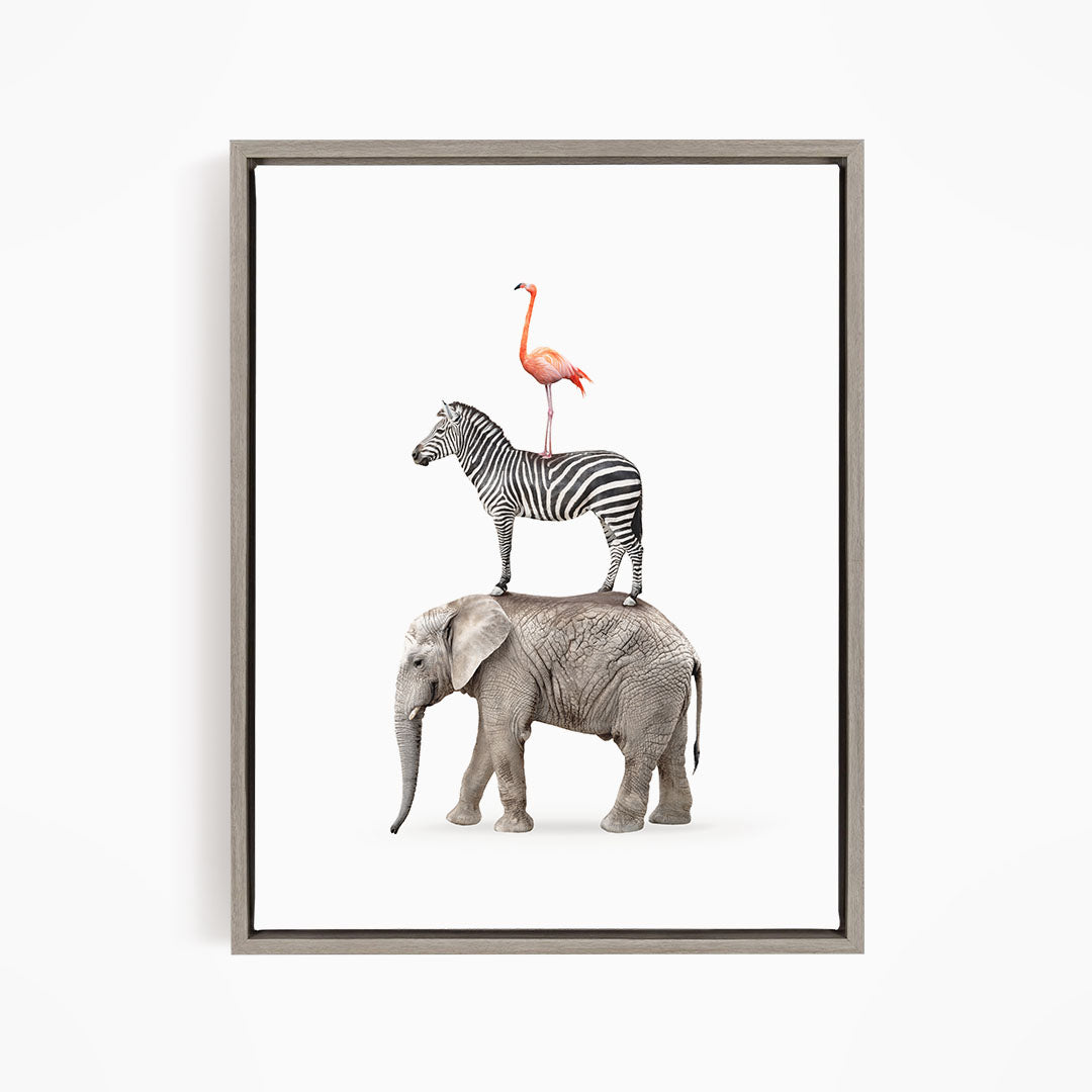 A framed image depicting a zebra, an elephant, and a flamingo standing together.