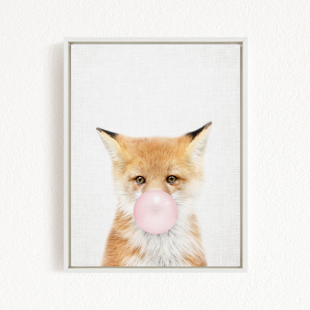 A framed image of a fox blowing a bubble with a pink bubble gum bubble.