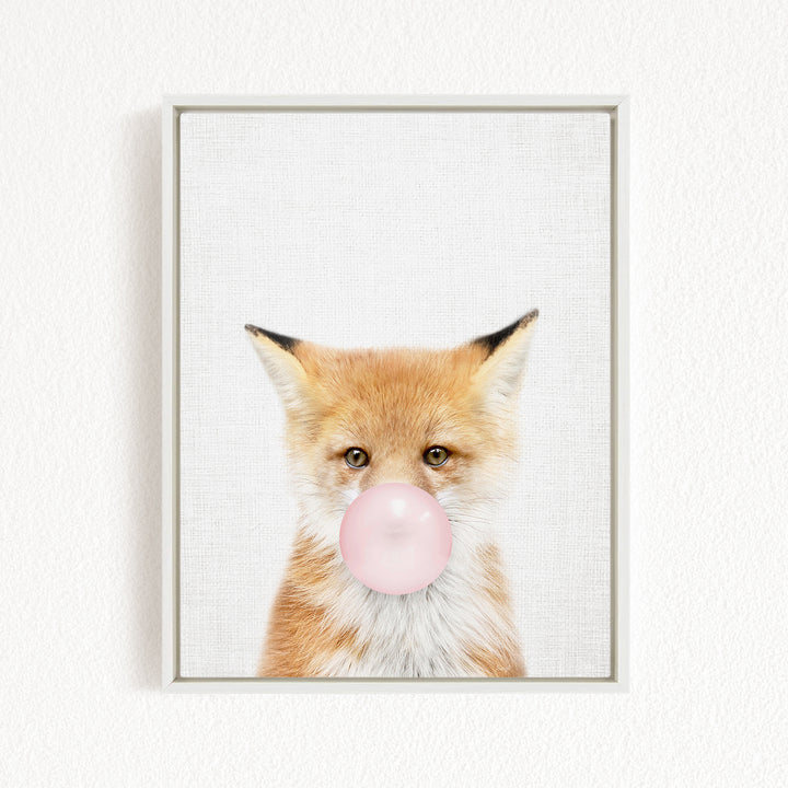 A framed image of a fox blowing a bubble with a pink bubble gum bubble.