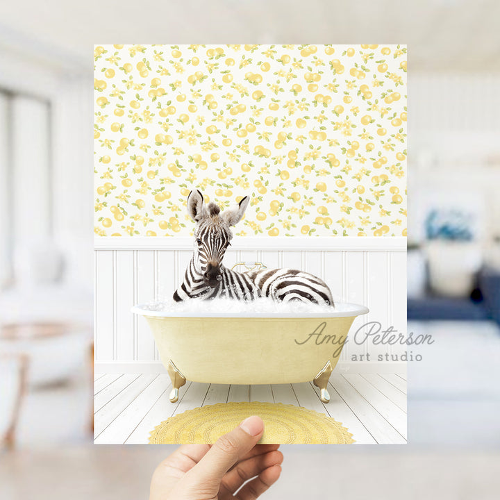 a person holding up a picture of a zebra in a bathtub