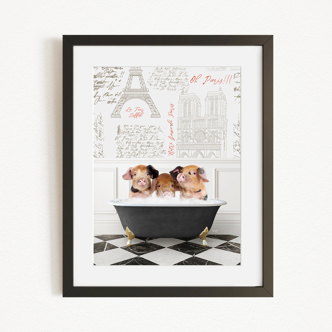 A framed image depicting three adorable pigs sitting in a bathtub, with a Paris-themed background featuring the Eiffel Tower and other Parisian landmarks.