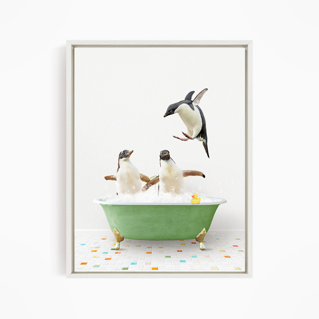 A framed image depicting two penguins sitting in a green bathtub, with one penguin flying towards the other penguin.