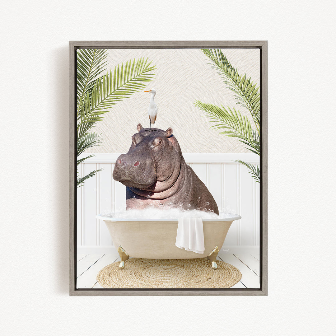 A framed image depicting a hippopotamus sitting in a bathtub, with a bird perched on its head.