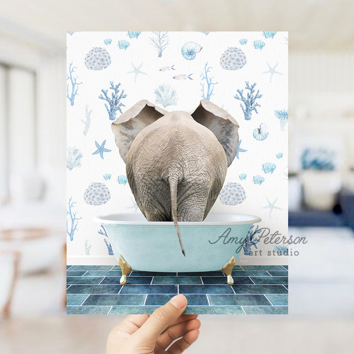 a person holding up a card with an elephant in a bathtub