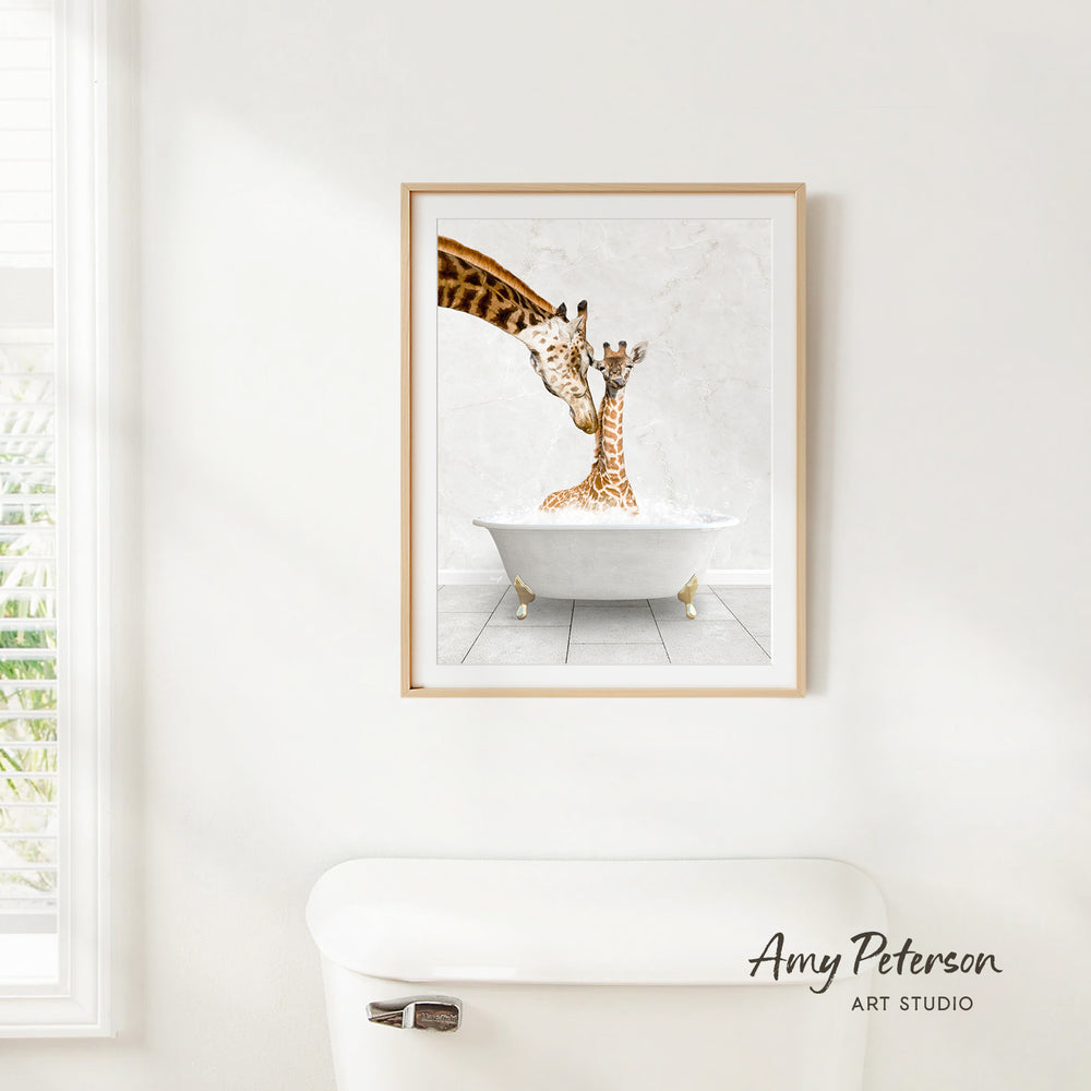 A framed painting of two giraffes sitting in a bathtub, with one giraffe appearing to be kissing the other giraffe.