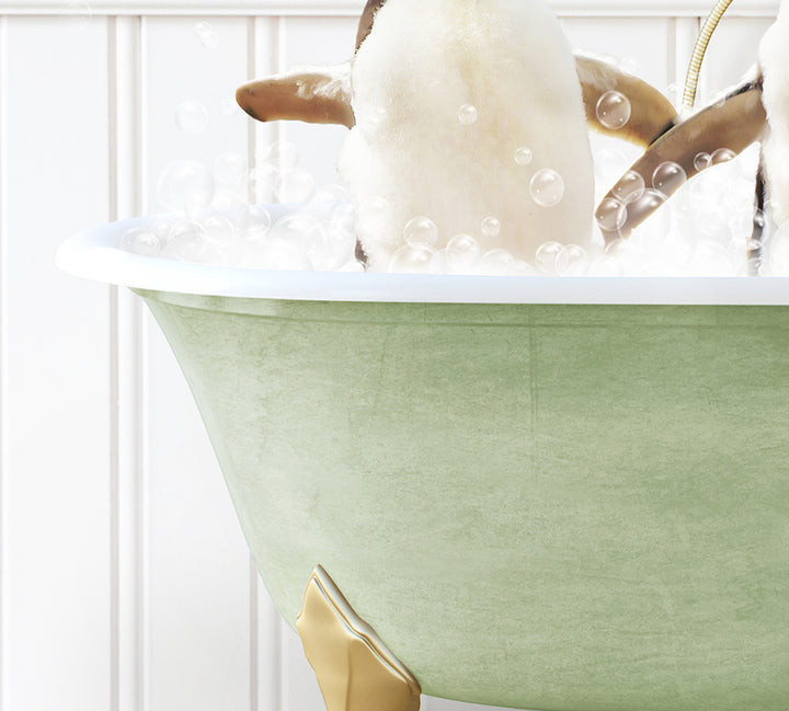 a bathtub filled with bubbles and a penguin in it