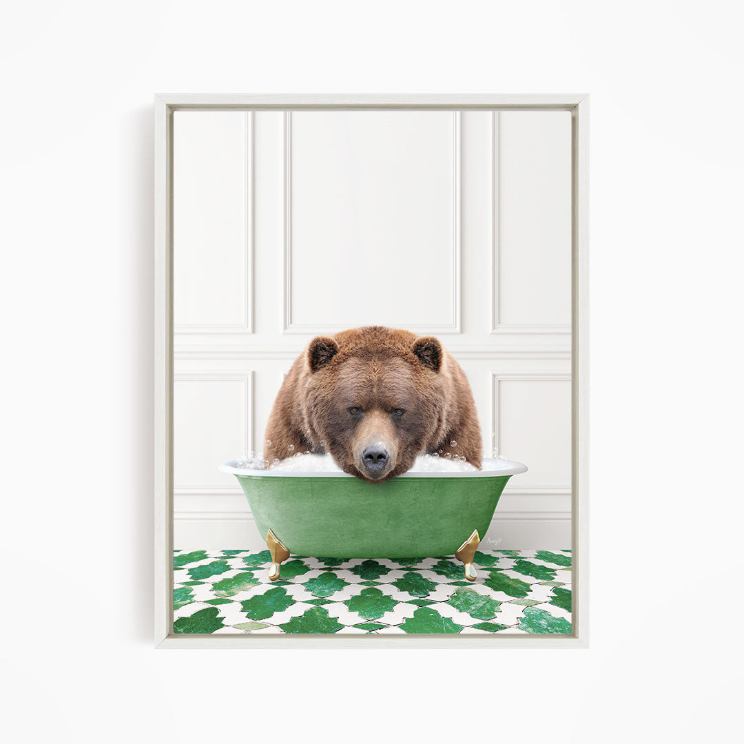 A brown bear is sitting in a green bathtub filled with water, appearing to be enjoying a relaxing bath.