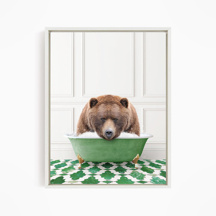 A brown bear is sitting in a green bathtub filled with water, appearing to be enjoying a relaxing bath.