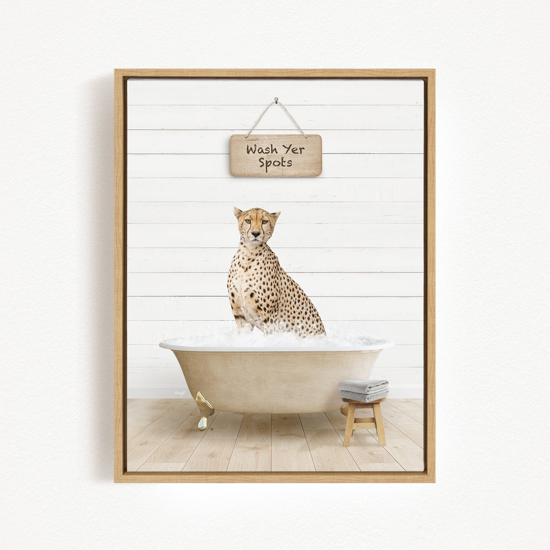 A cheetah sitting in a bathtub, with a sign above that says "Wash Yer Spots".