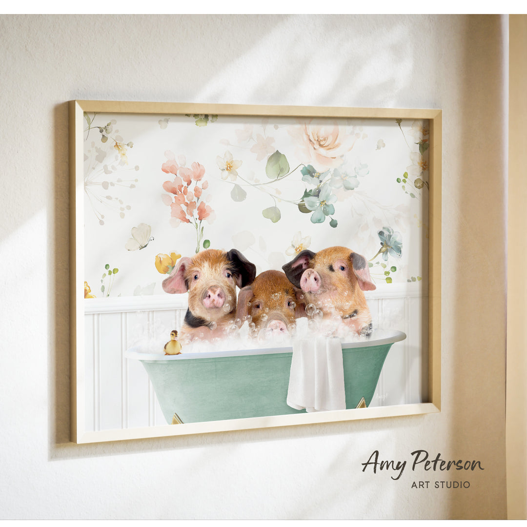 A framed print of three adorable pigs sitting in a bathtub, surrounded by a floral pattern.