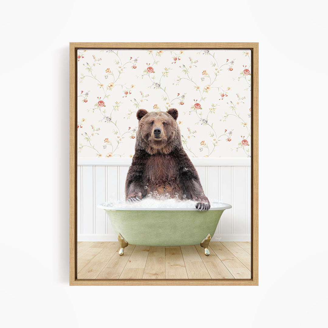 A brown bear sitting in a green bathtub filled with water, with a floral wallpaper in the background.