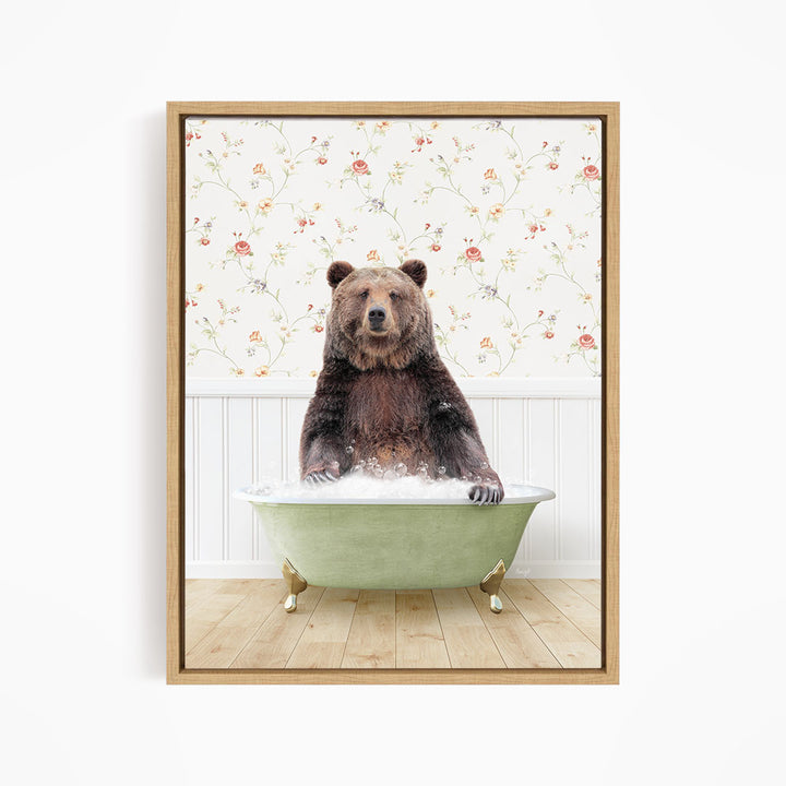 A brown bear sitting in a green bathtub filled with water, with a floral wallpaper in the background.