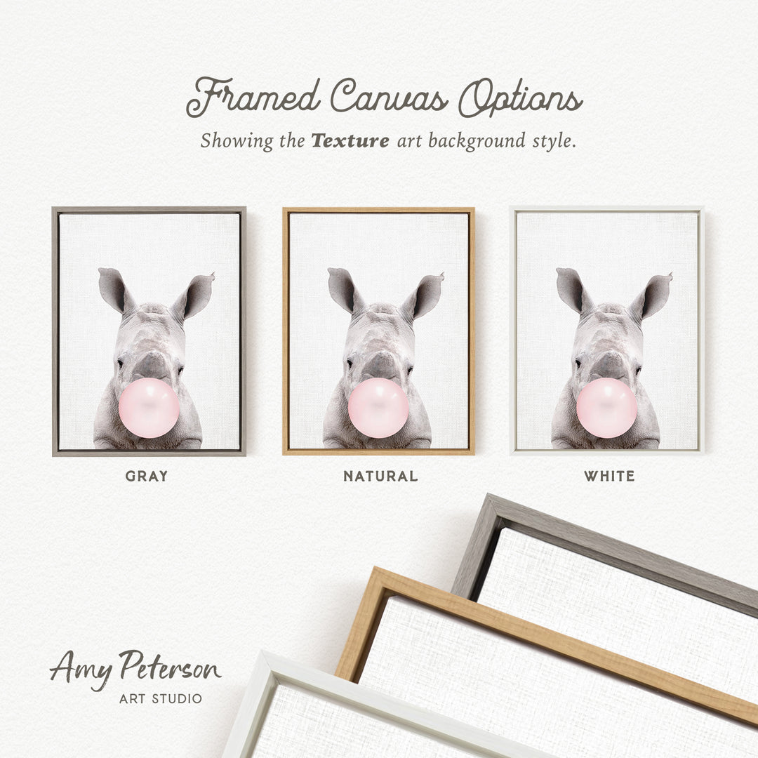 three framed canvas options, each featuring a rhinoceros blowing a bubble with a different colored bubble gum. The options are labeled as "Grays," "Natural," and "White," representing the color of the bubble gum.