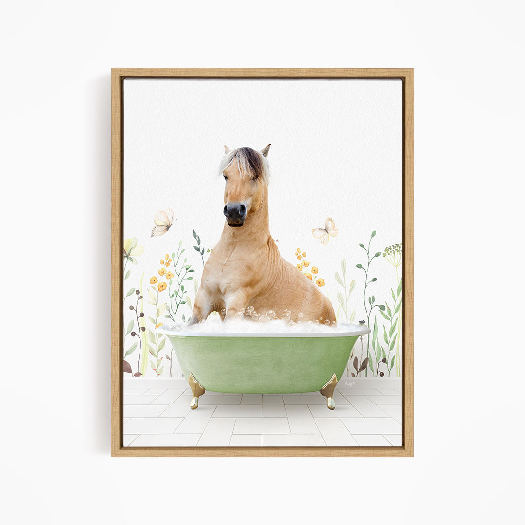 A light brown horse is sitting in a green bathtub filled with water, surrounded by flowers and butterflies.