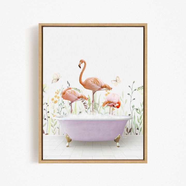 A framed image depicting three flamingos standing in a bathtub filled with water, surrounded by flowers and butterflies.