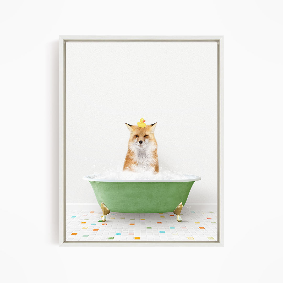 A fox is sitting in a green bathtub filled with bubbles, with a group of yellow rubber ducks floating on the water.