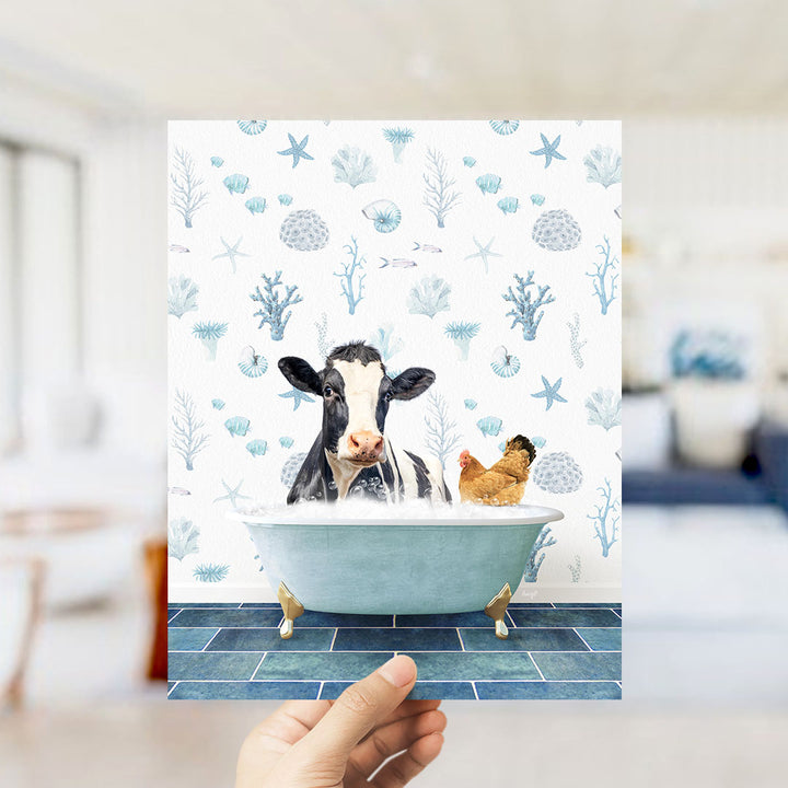 A cow and a chicken are sitting in a bathtub filled with bubbles, surrounded by a blue and white floral pattern.