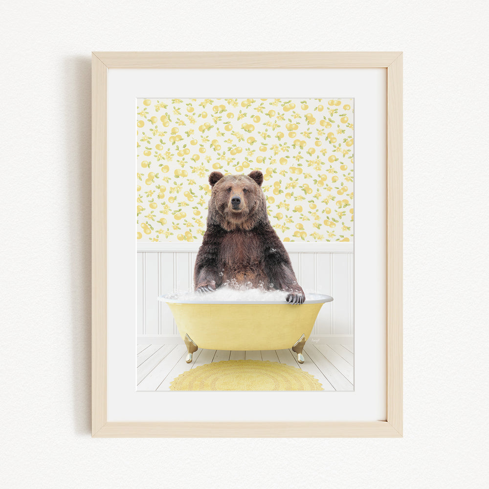 A brown bear sitting in a yellow bathtub, surrounded by a yellow floral pattern on the wall behind it.