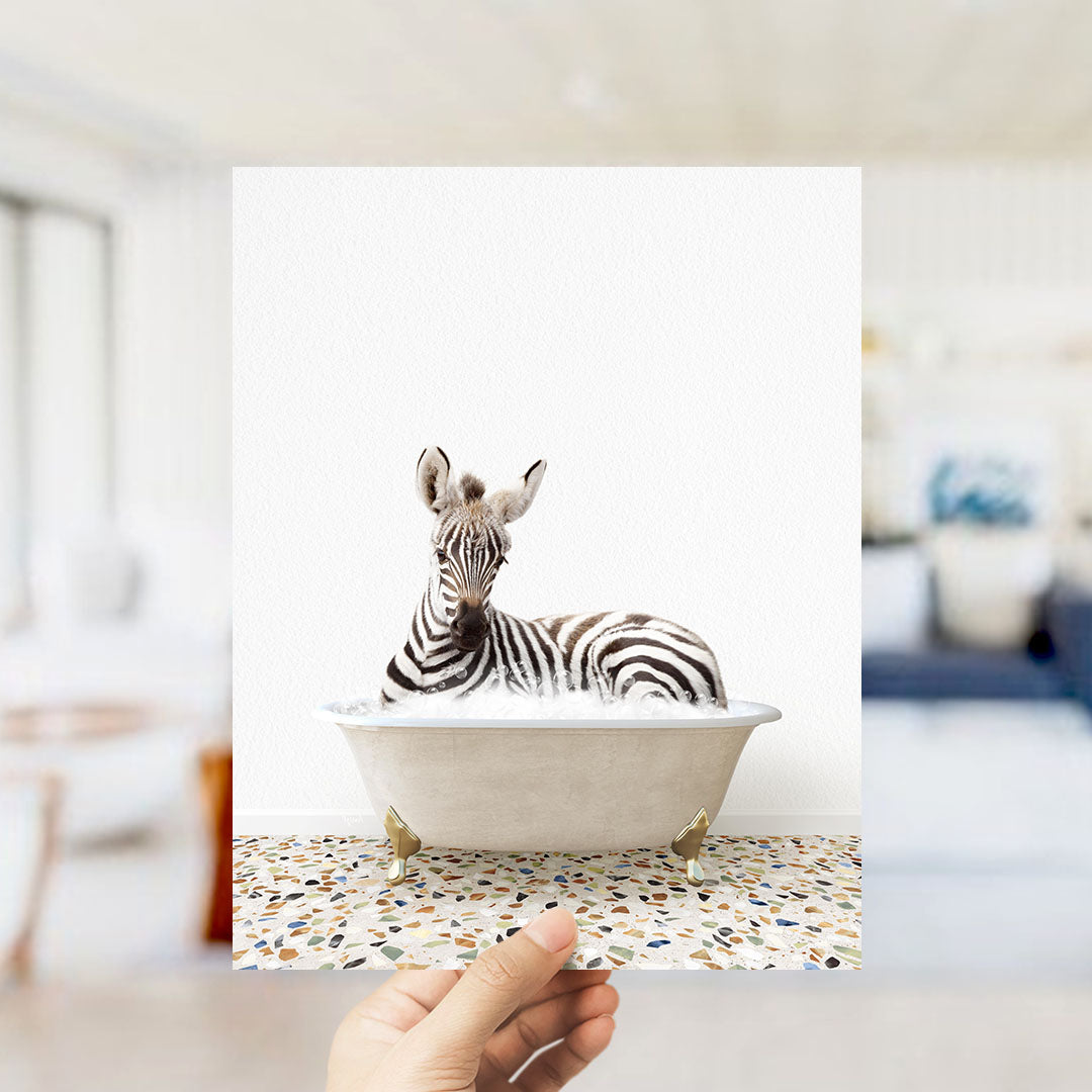 A zebra lying in a bathtub, surrounded by a mosaic floor.