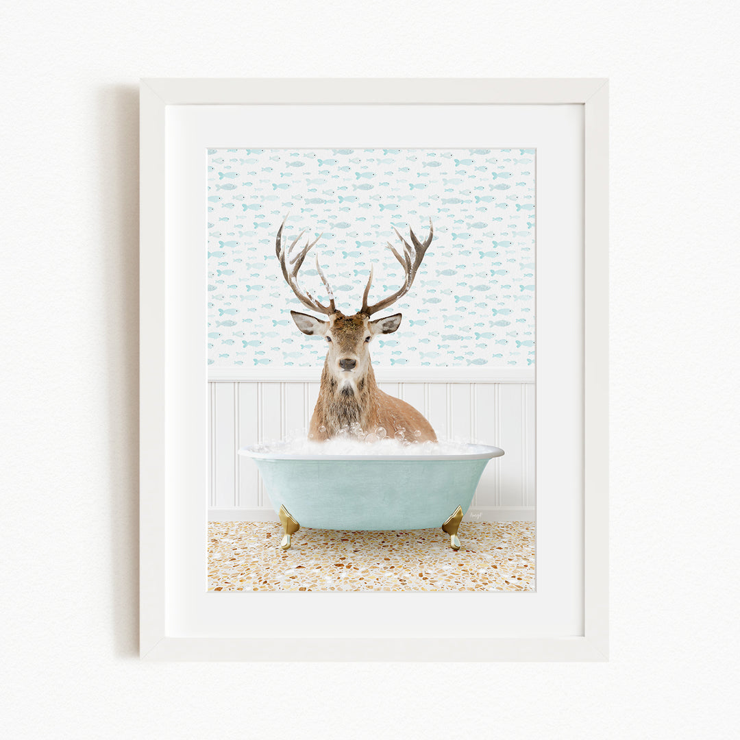 A deer with antlers is sitting in a light blue bathtub, surrounded by a patterned wall and floor.