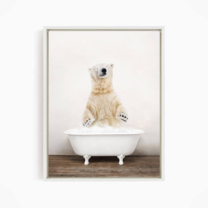 A polar bear standing in a white bathtub filled with water, with its paws raised in the air.