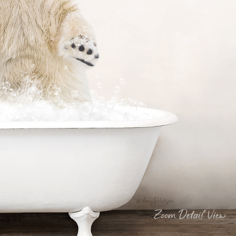 A polar bear's paw is partially submerged in a white bathtub filled with bubbles, creating a playful and whimsical scene.