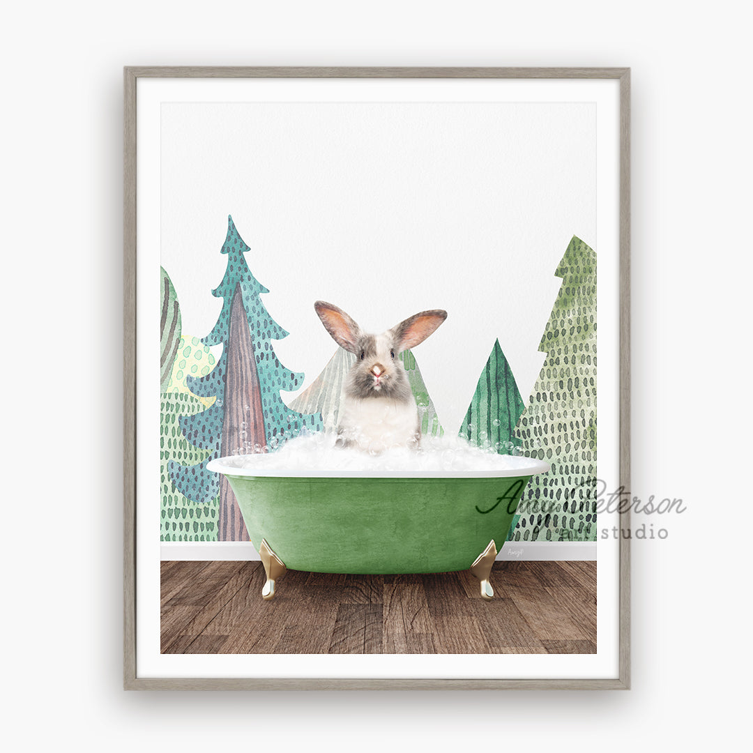 a rabbit sitting in a green bathtub with trees in the background