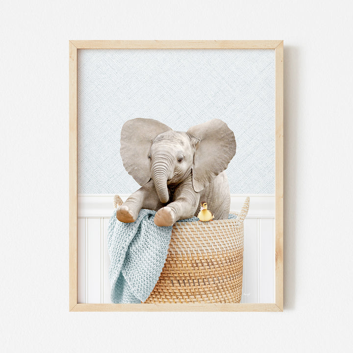 a picture of an elephant sitting in a basket