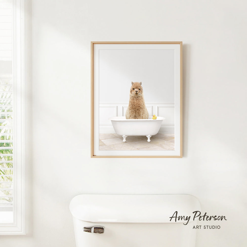 A framed photograph of a dog sitting in a bathtub, with a window and a toilet visible in the background.
