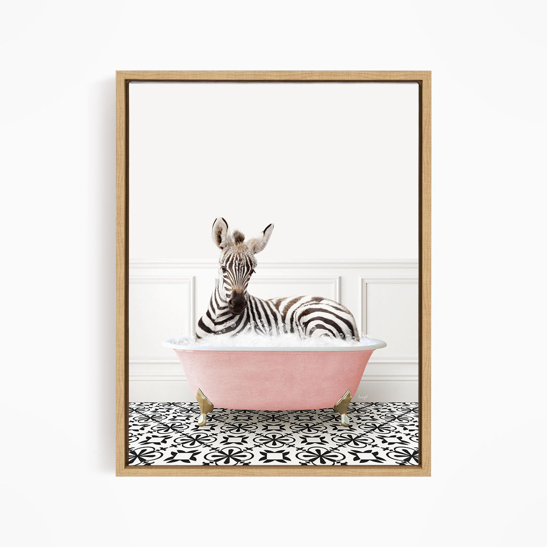 A zebra is sitting in a pink bathtub, surrounded by a black and white patterned floor.