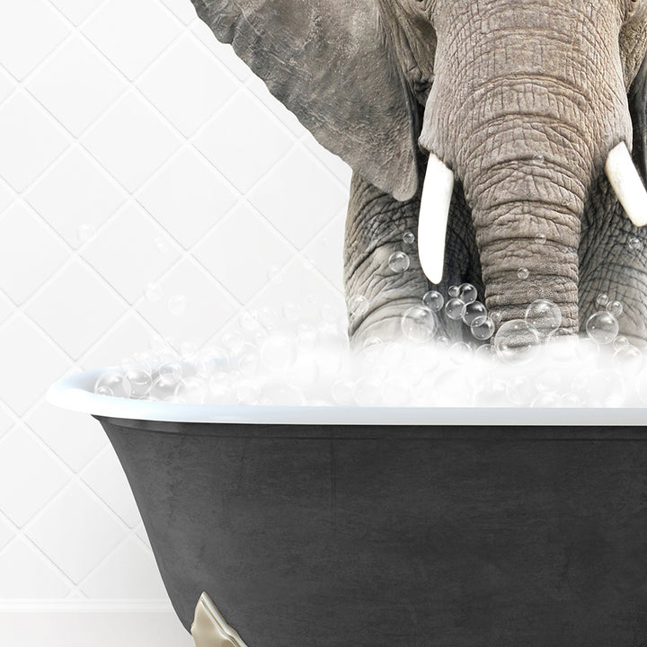 an elephant is taking a bath in a bathtub