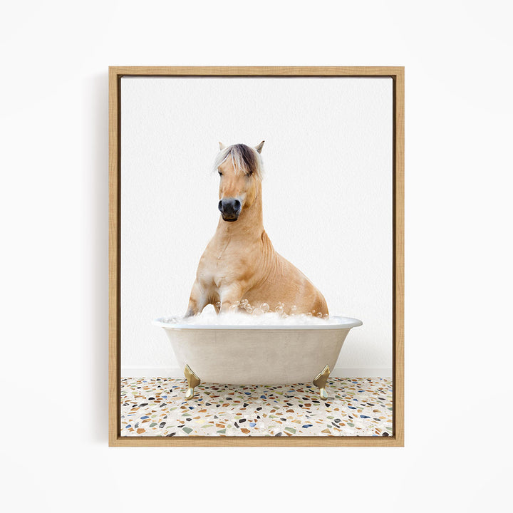 A light brown horse is sitting in a white bathtub filled with water, creating a whimsical and playful scene.