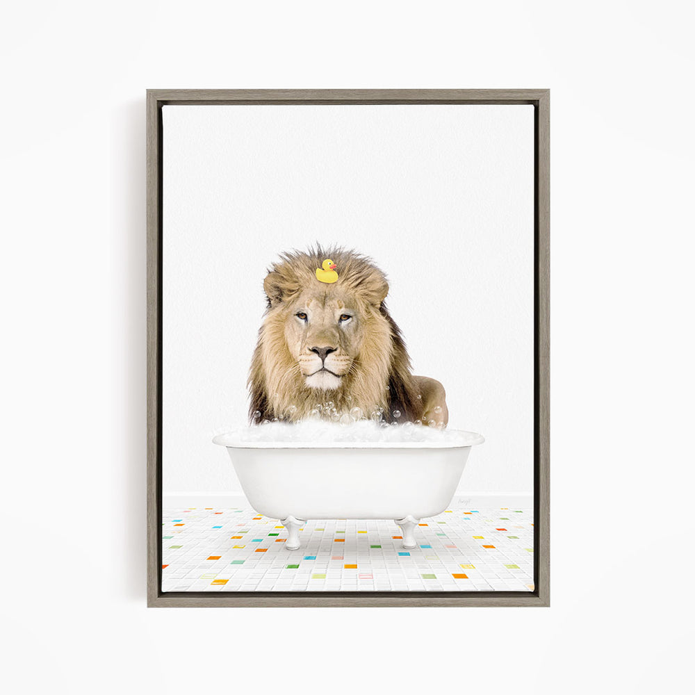 A lion is sitting in a white bathtub filled with bubbles, with a rubber duck floating on its head.