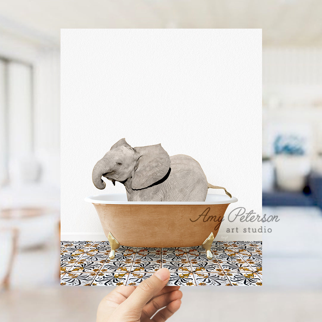 a hand holding a card with an elephant in a bathtub