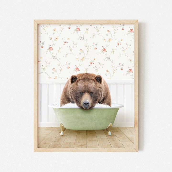 a brown bear sitting in a green bath tub