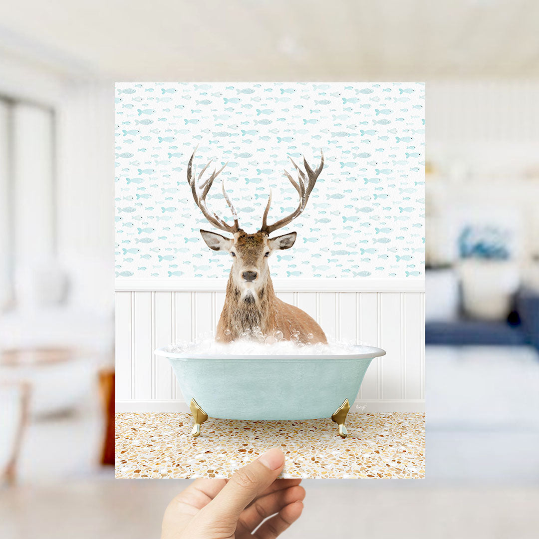 A deer with antlers is sitting in a bathtub filled with bubbles, surrounded by a pattern of fish.