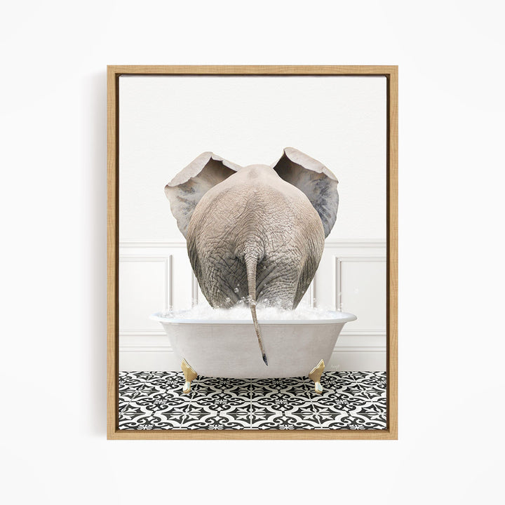 A gray elephant is standing in a white bathtub filled with water, with its trunk submerged in the water.