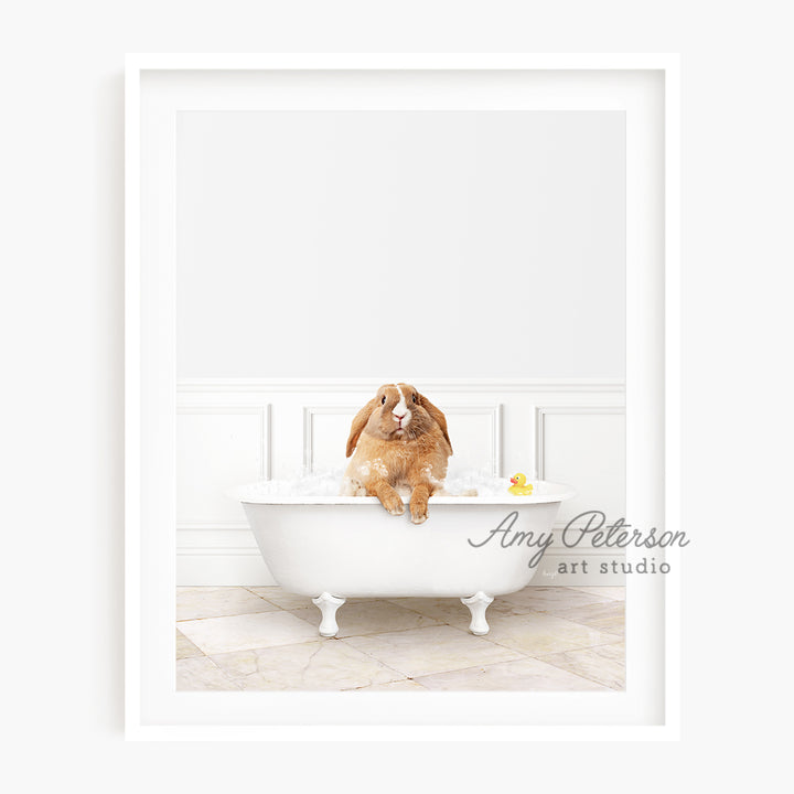 a dog sitting in a bathtub with a rubber duck in it