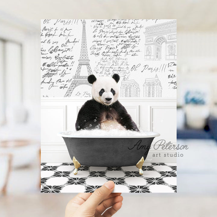 a person holding up a card with a picture of a panda in a bathtub