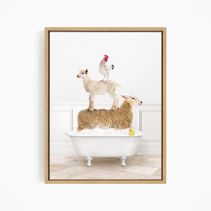 A framed image depicting a sheep standing on a chicken's back while a lamb sits in a bathtub, with a rubber duck floating in the water.