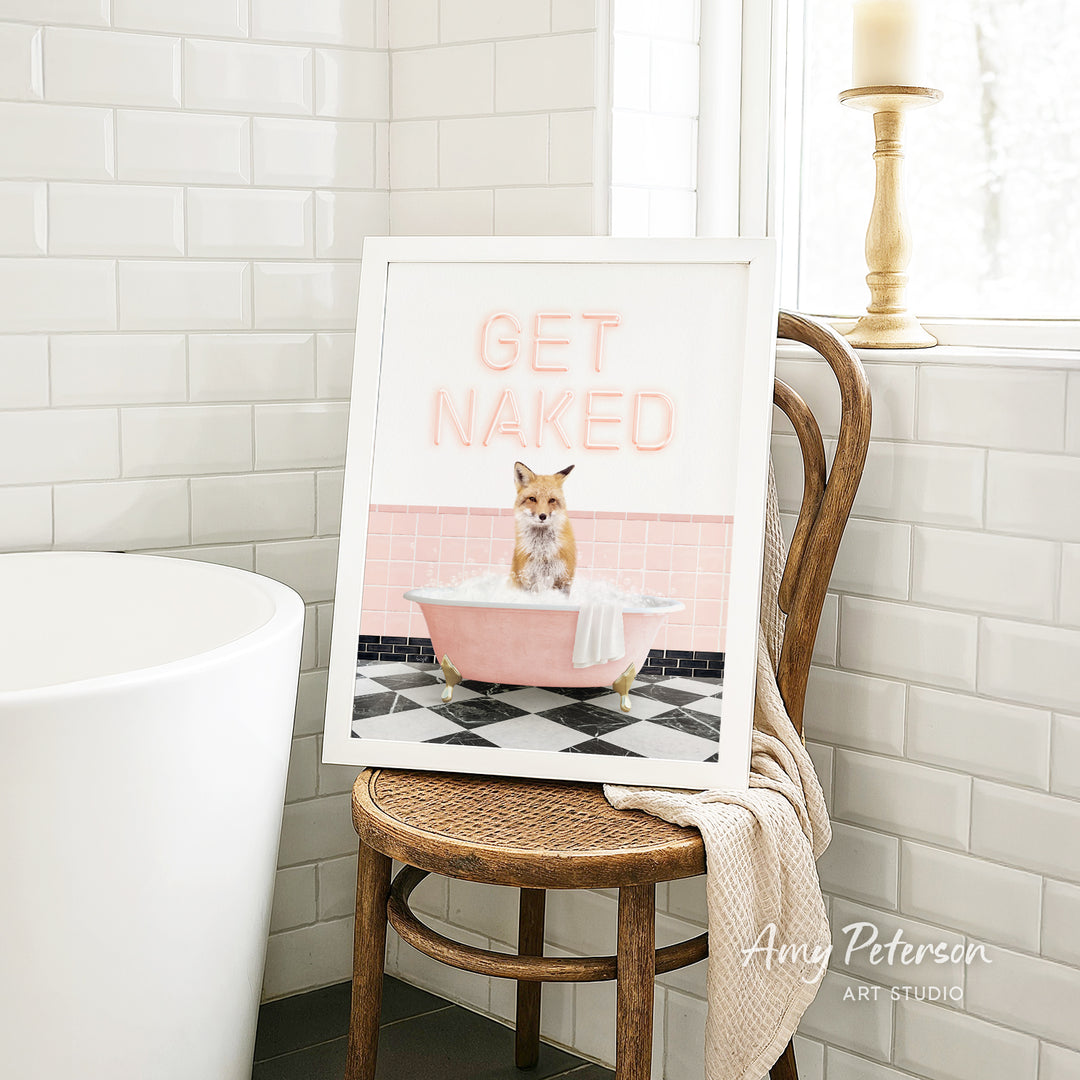 A framed image of a cat sitting in a pink bathtub, with the text "GET NAKED" displayed on the frame.