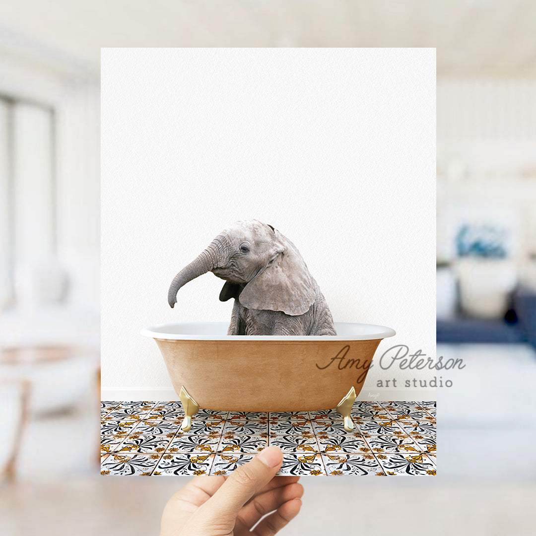 a hand holding a card with an elephant in a bathtub