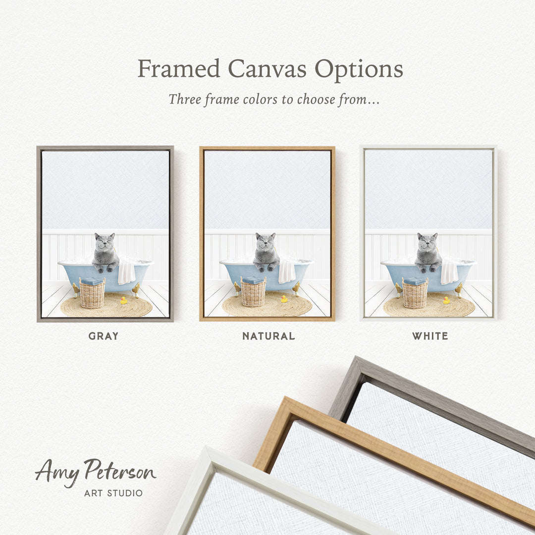 The image is a framed canvas option showcasing three different frame colors: gray, natural, and white. The canvas features a cat sitting in a bathtub, and the frame color options are displayed below the canvas.