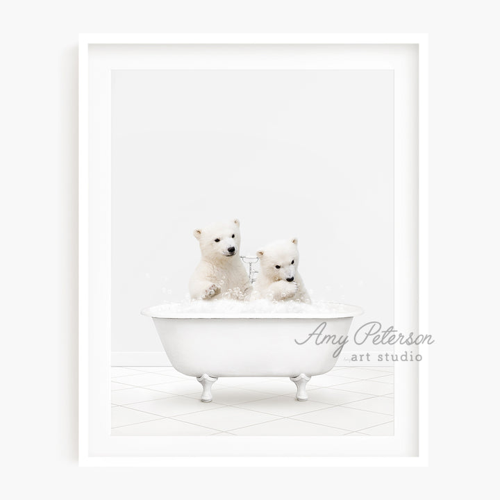 two polar bears are sitting in a bathtub