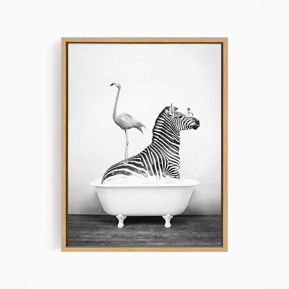 A zebra is sitting in a bathtub, with a flamingo standing on its back legs and a bird perched on its head.