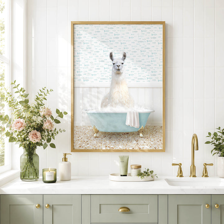 A framed image of a white llama sitting in a blue bathtub, surrounded by a floral arrangement and a green vase on a white countertop.