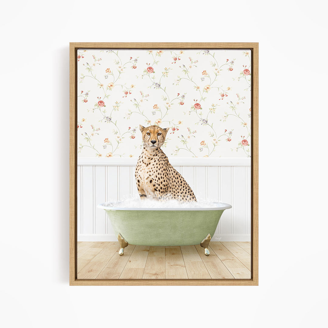 A cheetah sitting in a green bathtub filled with water, with a floral wallpaper in the background.