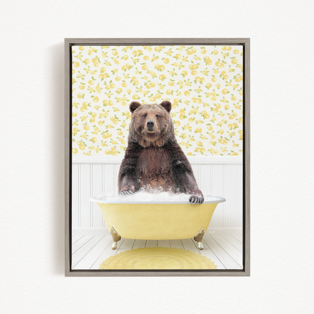 A brown bear sitting in a yellow bathtub filled with water, surrounded by a yellow floral pattern on the wall behind it.