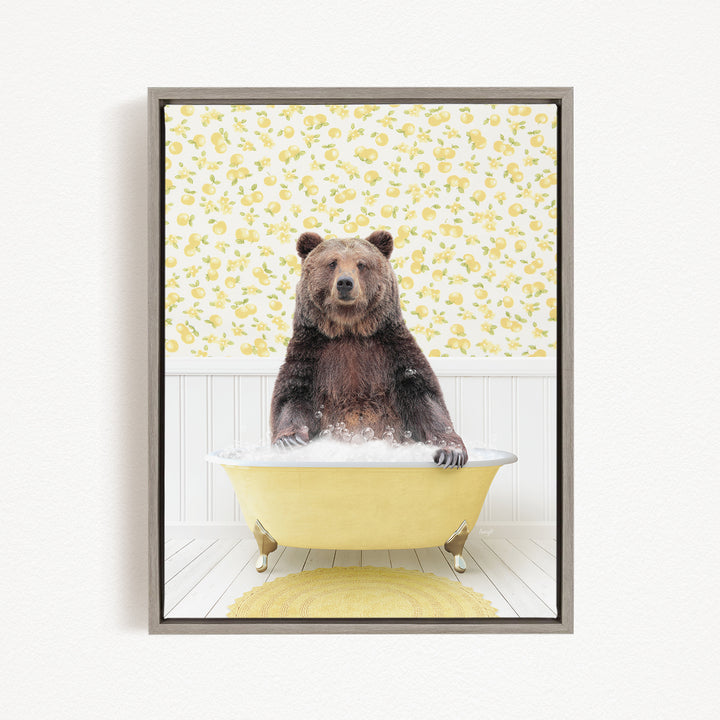 A brown bear sitting in a yellow bathtub filled with water, surrounded by a yellow floral pattern on the wall behind it.