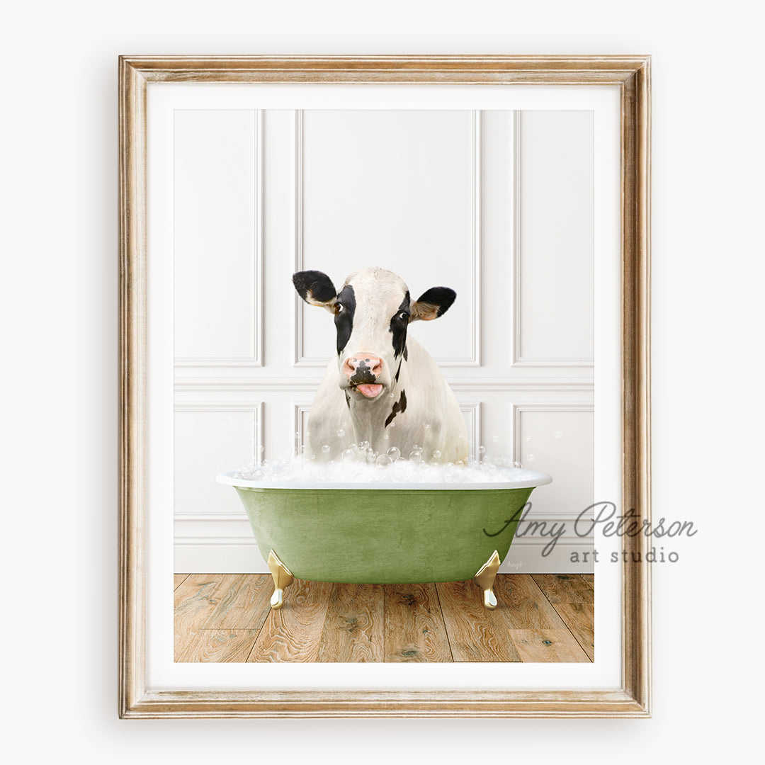 a cow sitting in a green bath tub